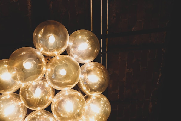 A set of smart light bulbs emitting colorful ambient light in a cozy room.