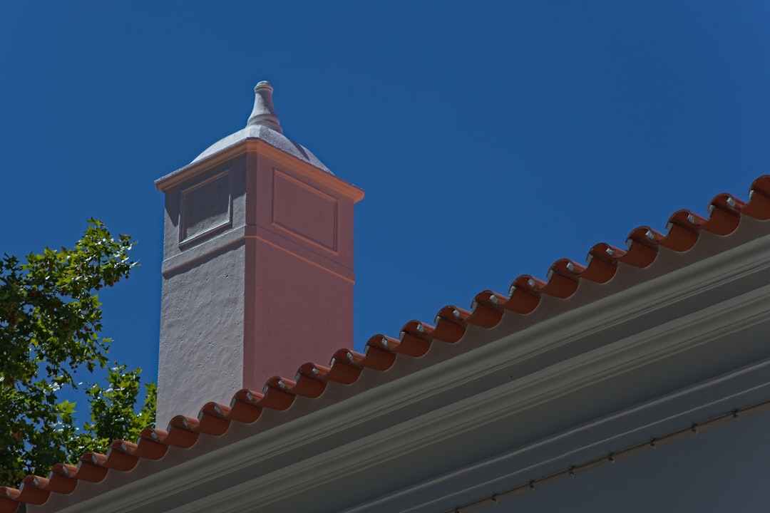 brown and white concrete building under blue sky during daytime