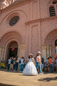 people standing in front of brown concrete building during daytime
