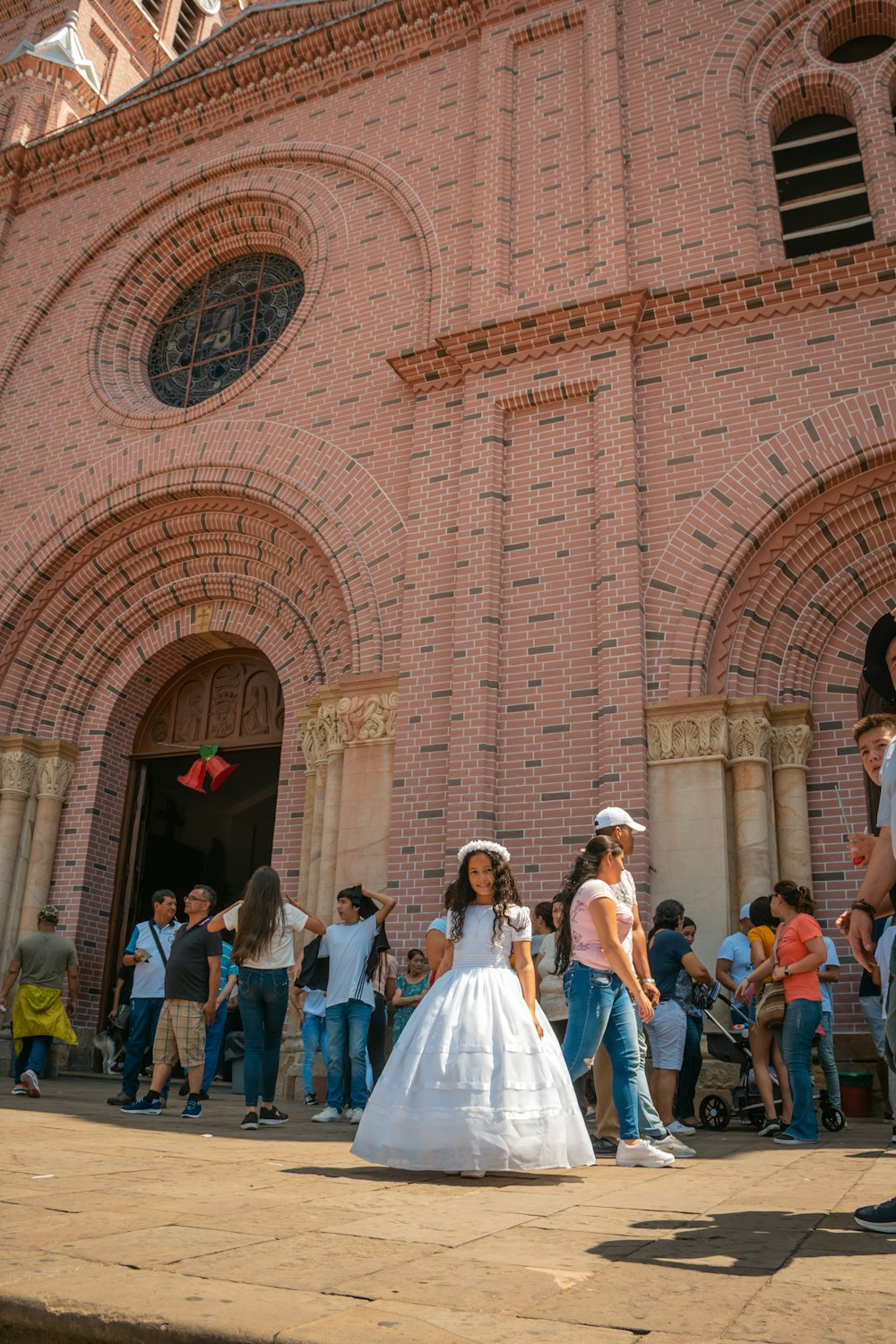 people standing in front of brown concrete building during daytime