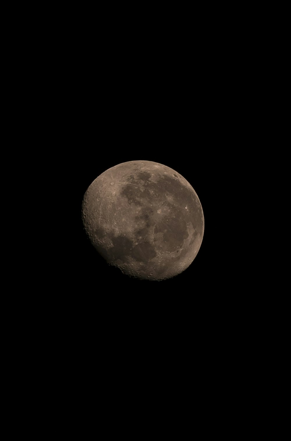 orange moon in dark night sky