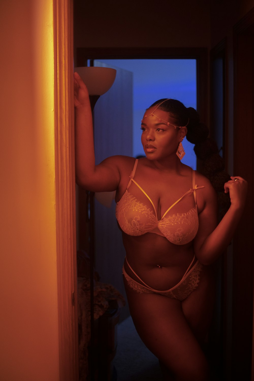 woman in brown bra and panty standing near door