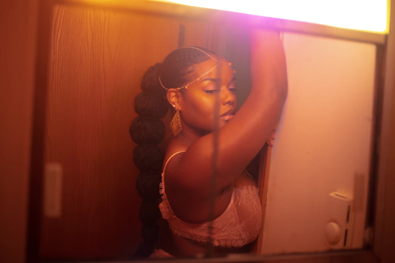 Intellectual BBW woman in white lace tank top and eyeglasses