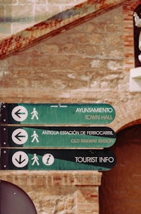 green and black wooden signage