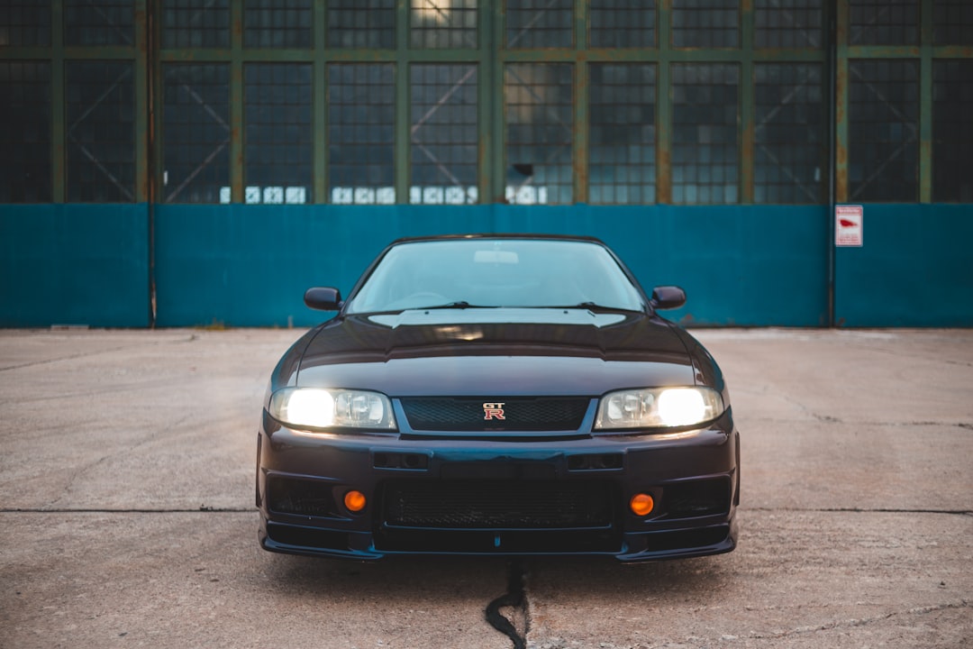 black bmw m 3 parked on gray concrete pavement