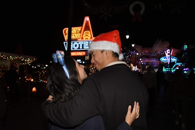 A happy pair exchanging gifts during a festive holiday celebration