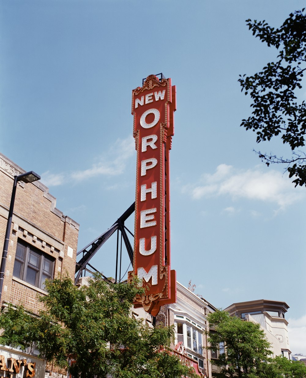 a large red sign on the side of a building