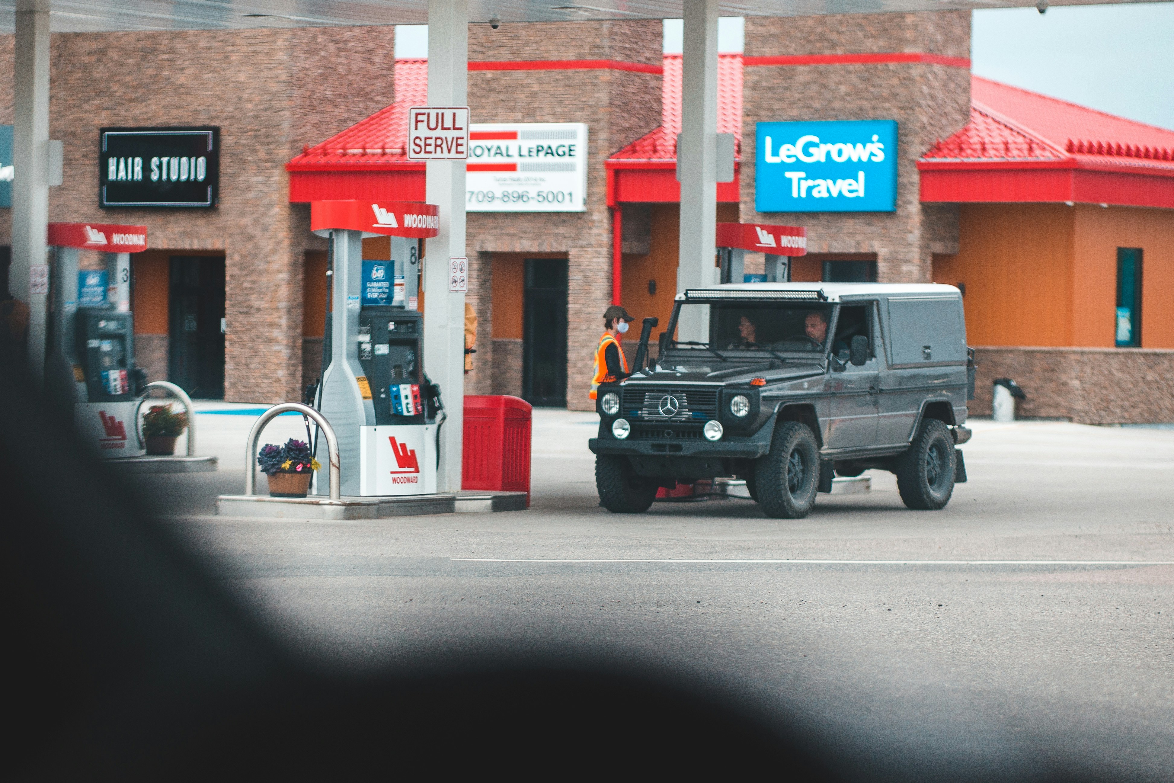 Electric pickup truck charging at a public station in the United States