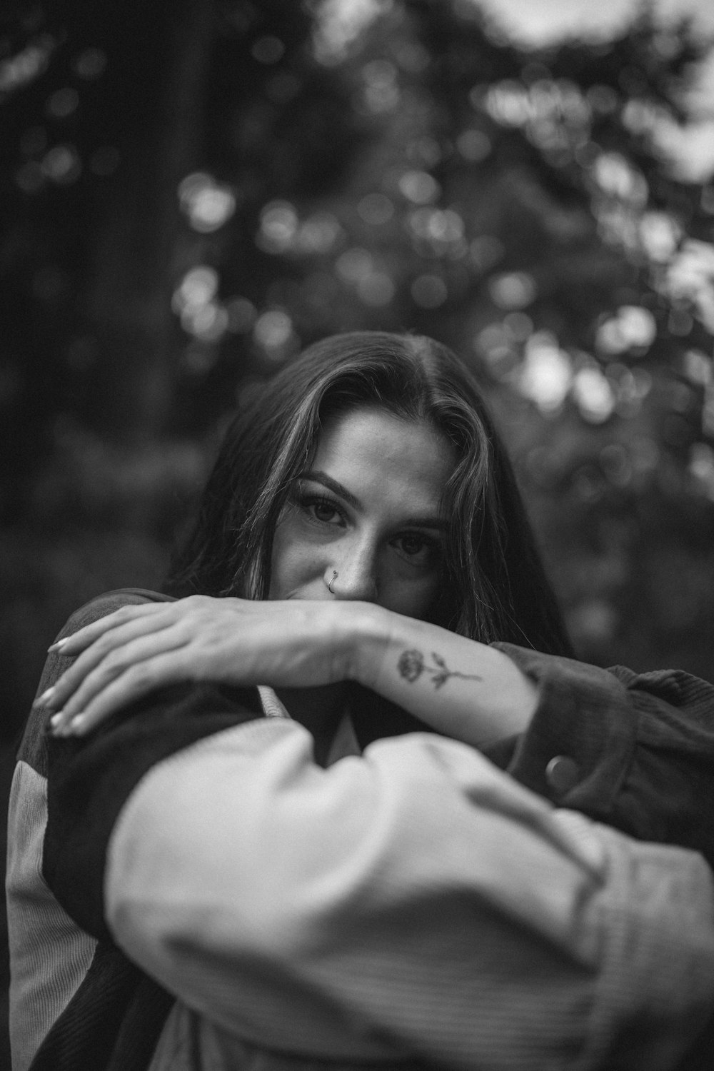 grayscale photo of woman in black long sleeve shirt