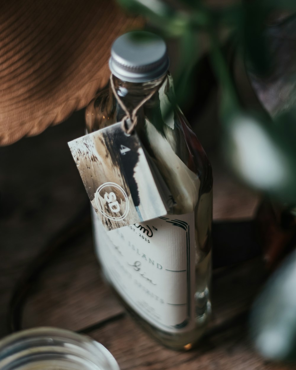 white labeled bottle on brown wooden table