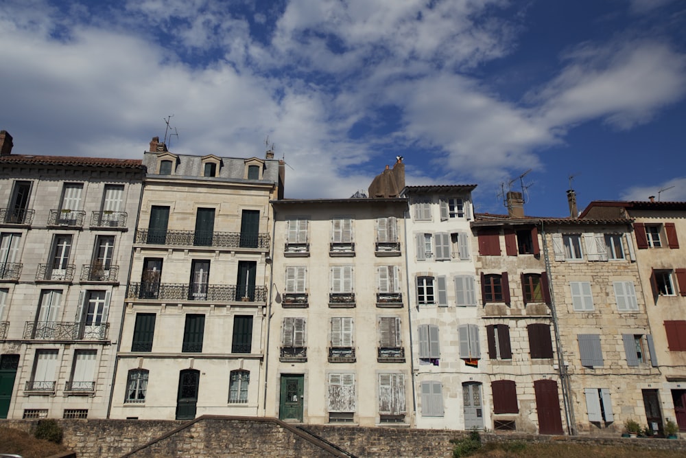 white and green concrete building under blue sky during daytime