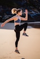 woman in black leggings and white sports bra