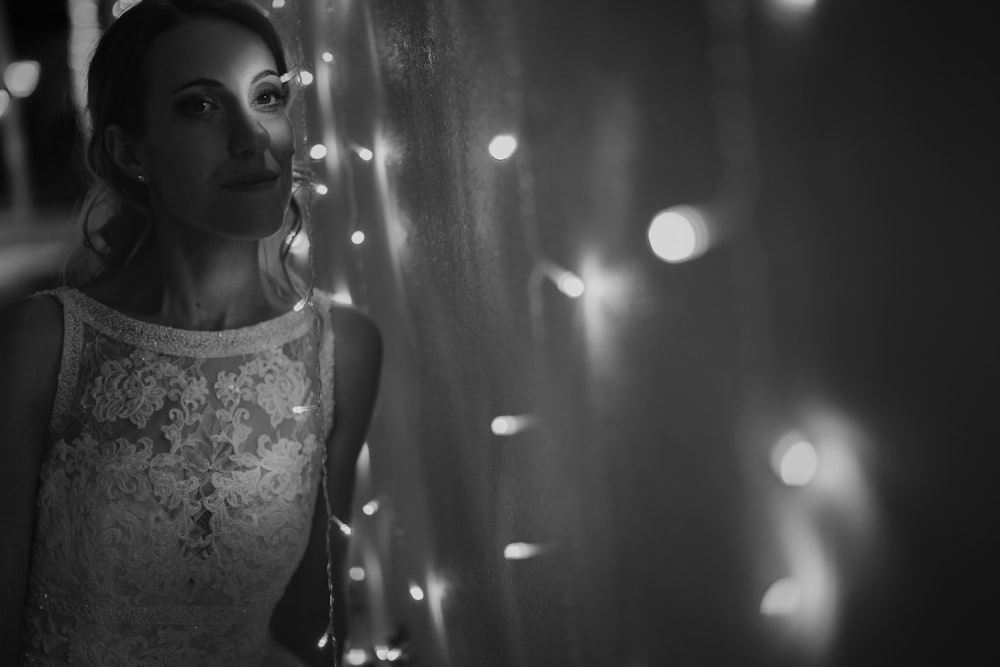 grayscale photo of woman in floral tank top