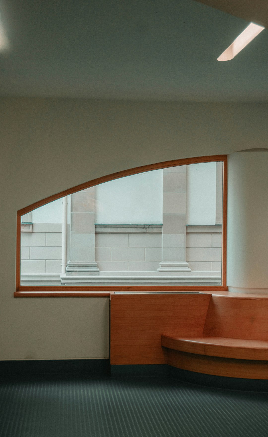 brown wooden table near window