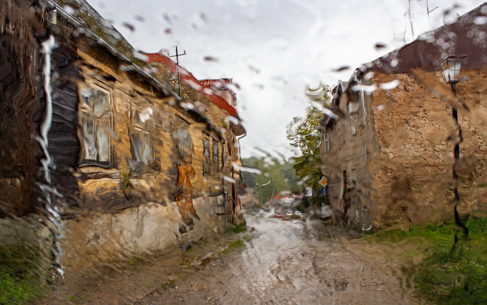 brown and white concrete houses under white cloudy sky during daytime