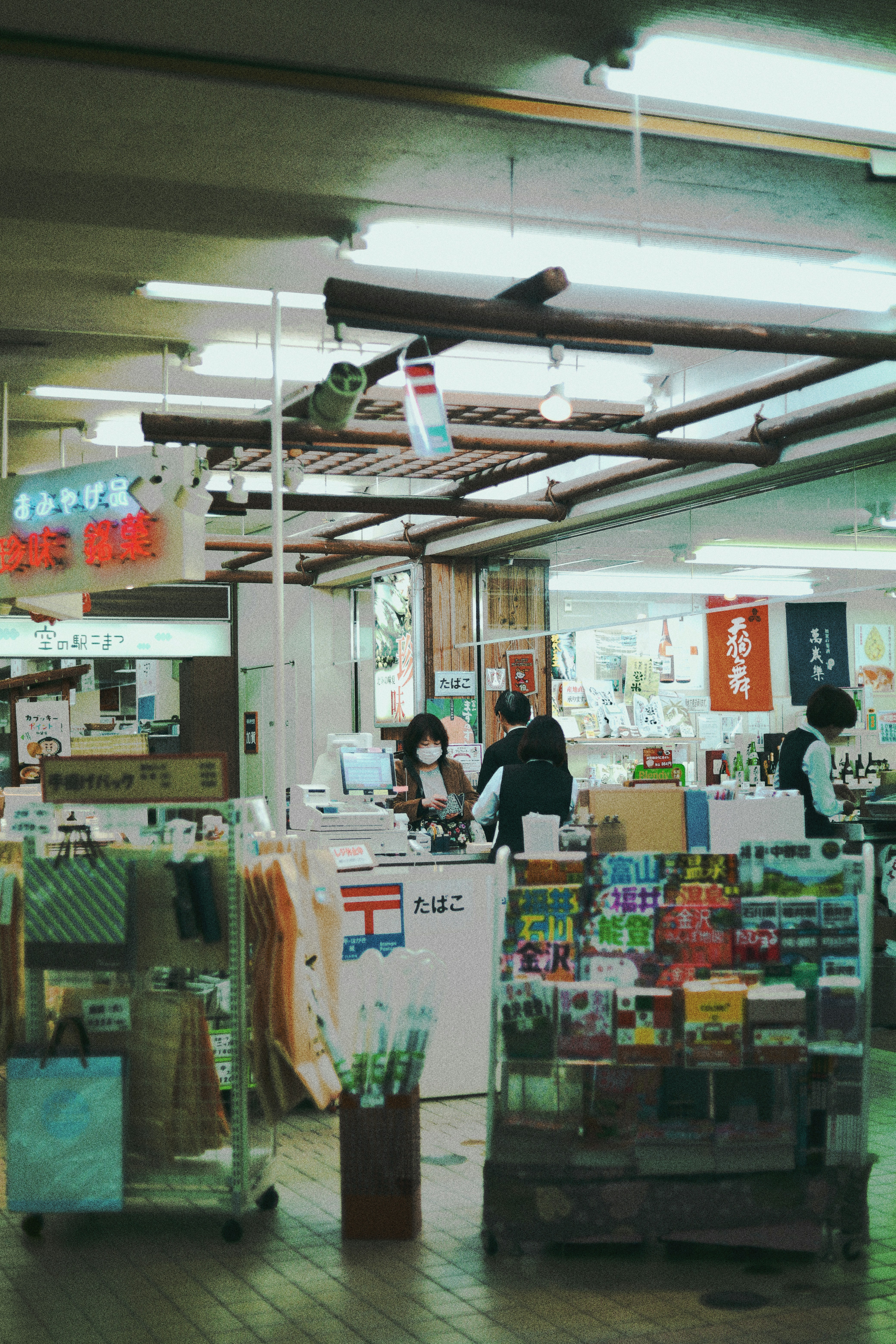 people standing in front of food counter