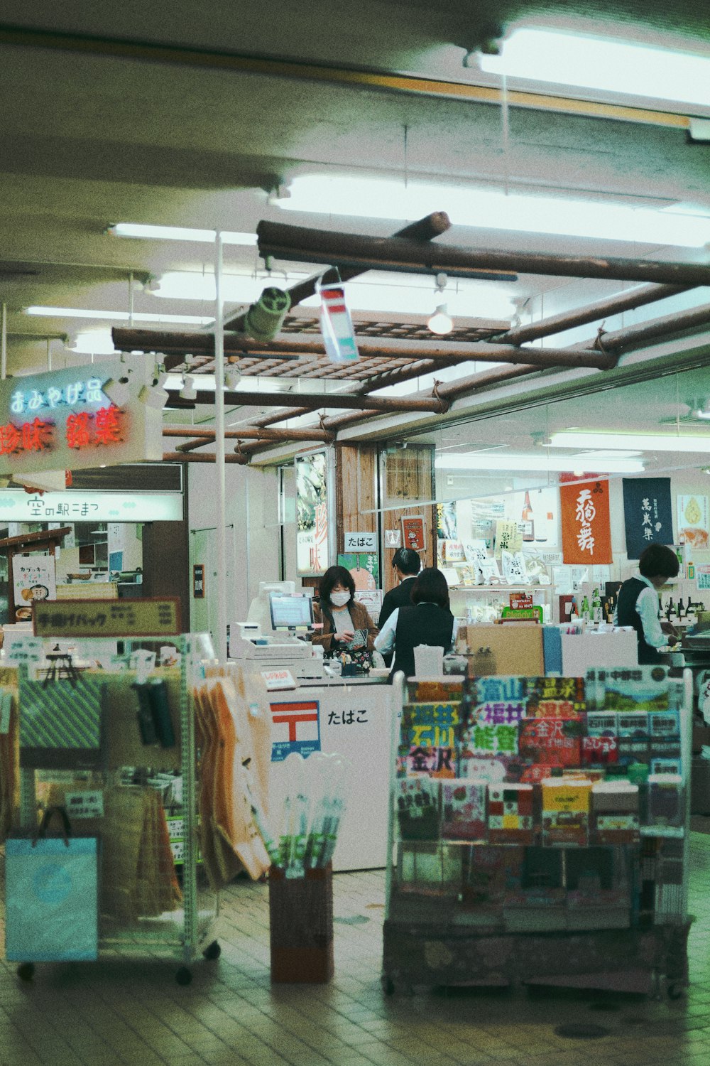 people standing in front of food counter