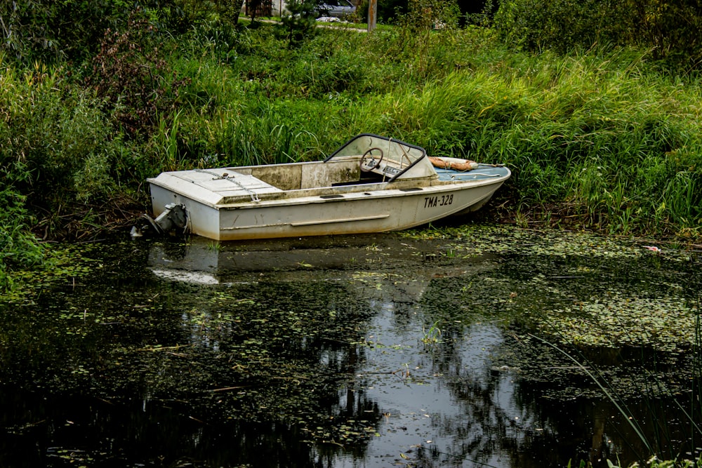 white and brown boat on water