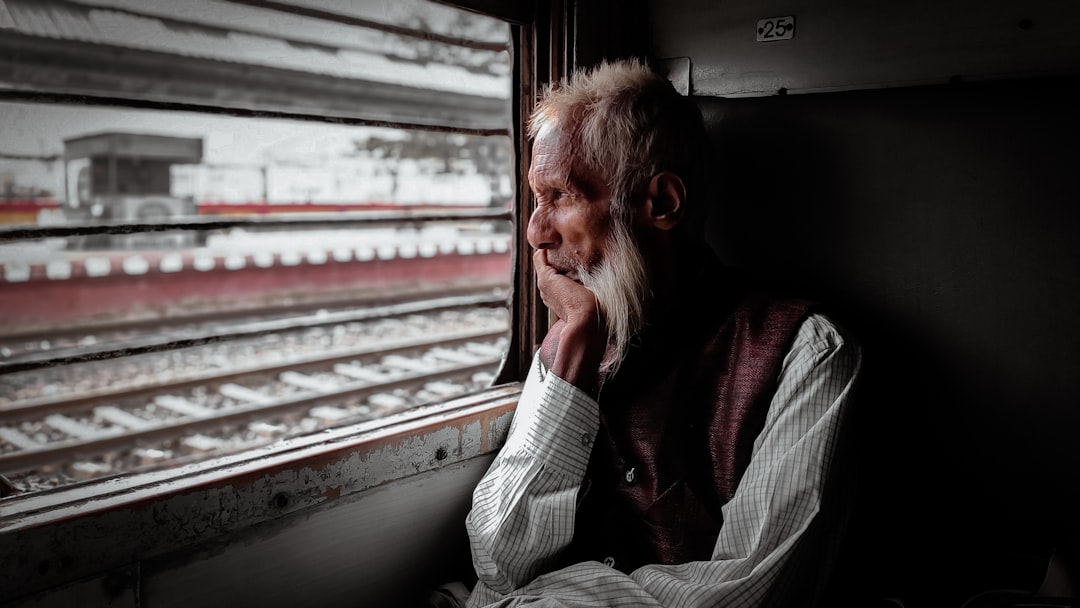 woman in white sweater sitting on car seat, Lost in thoughts.