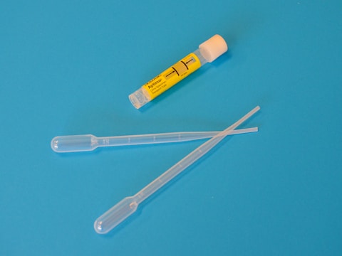 white ballpoint pen beside yellow and white plastic tool