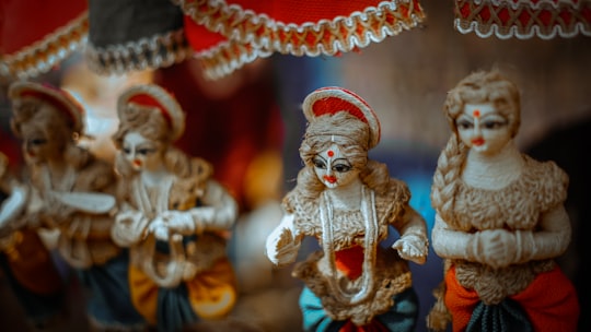 gold and red hindu deity figurine in Surajkund India