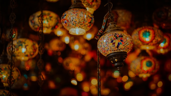 selective focus photography of oriental red and blue floral pendant lamp