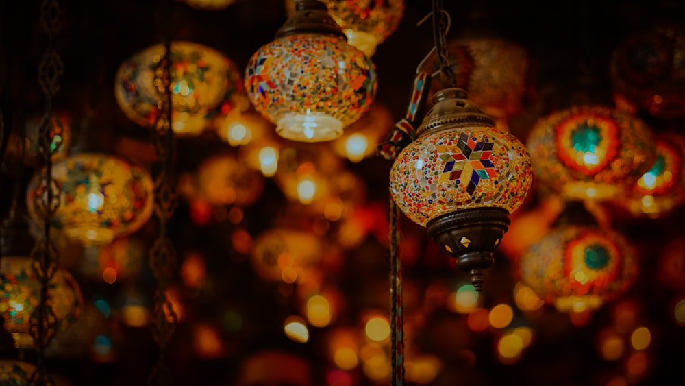 selective focus photography of red and blue floral pendant lamp