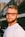 man in white crew neck shirt wearing black framed eyeglasses