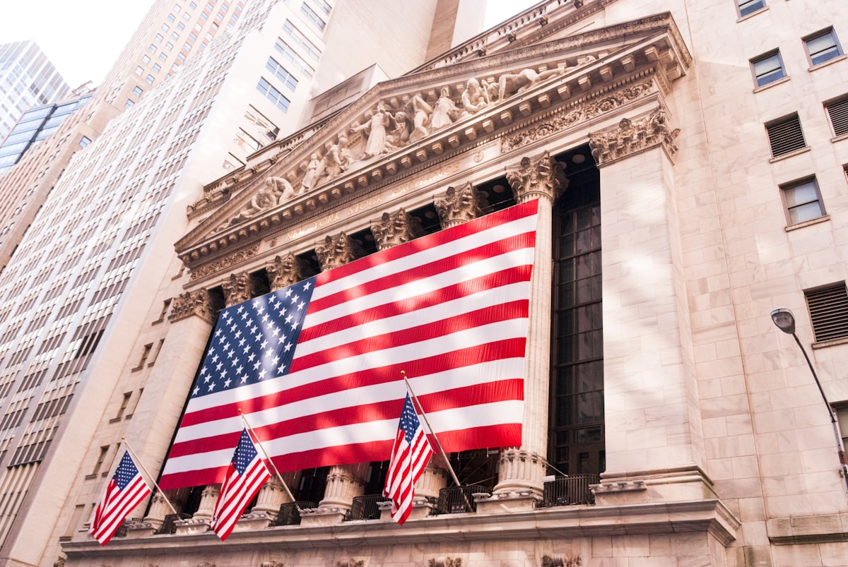 New York Stock Exchange building facade with American flag