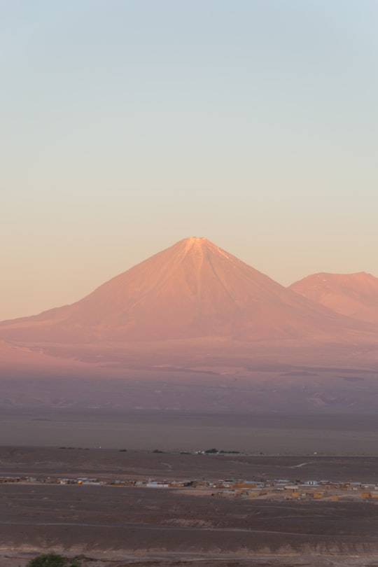 brown mountain under white sky during daytime in San Pedro de Atacama Chile