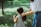 woman in white dress holding her hair