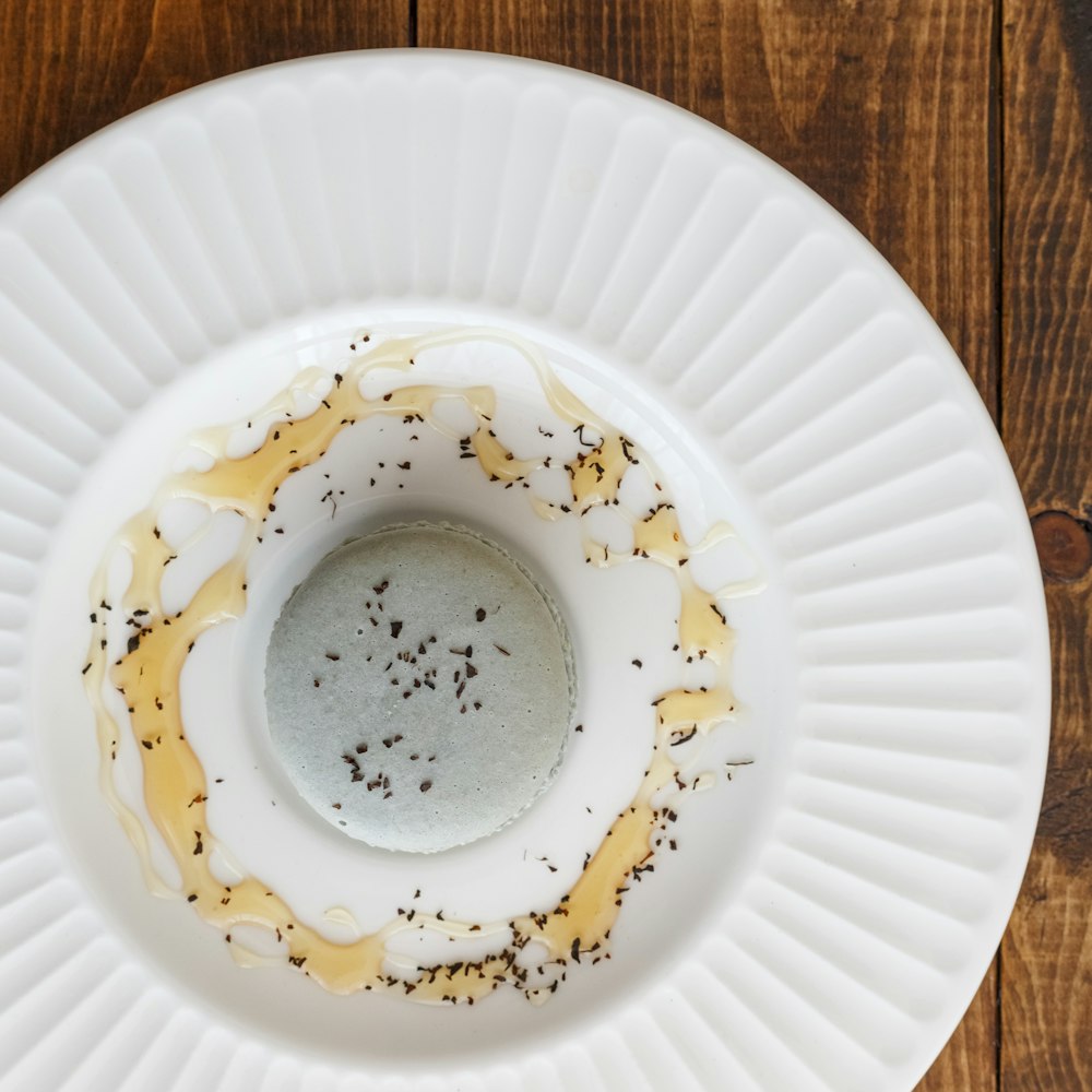 white ceramic plate on brown wooden table