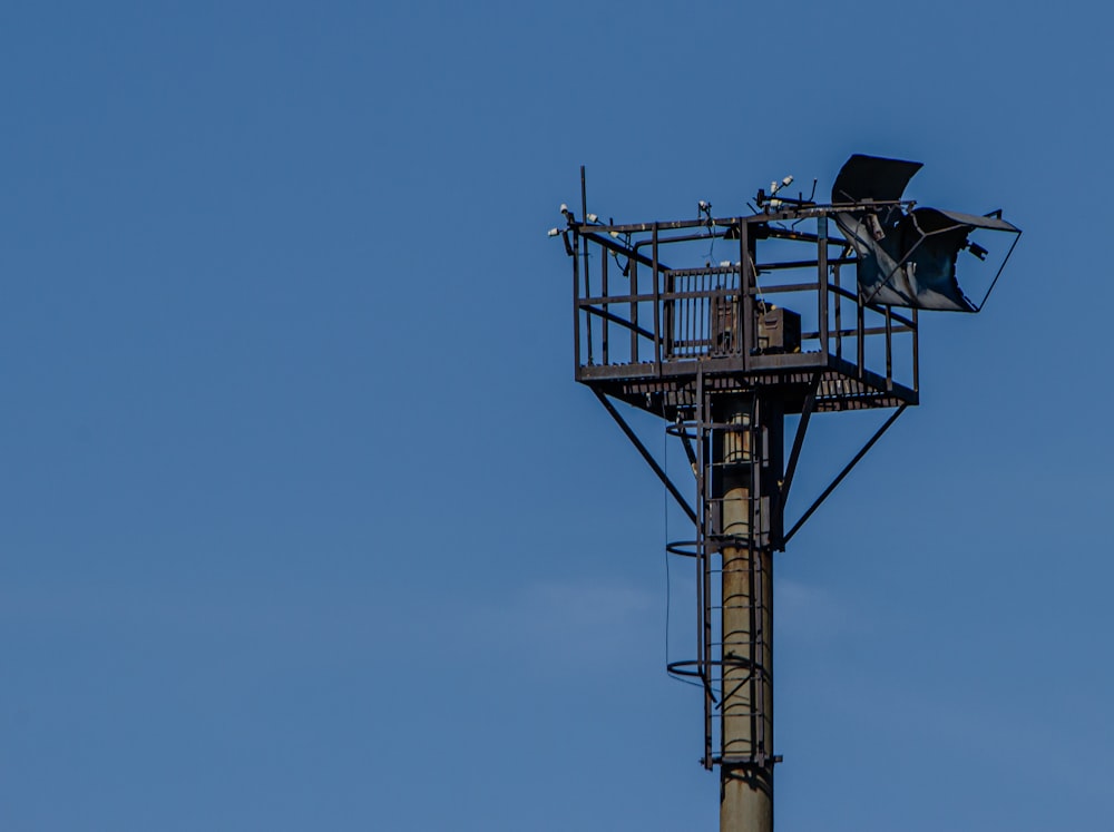 black and gray street light under blue sky during daytime