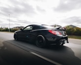 black porsche 911 on road during daytime