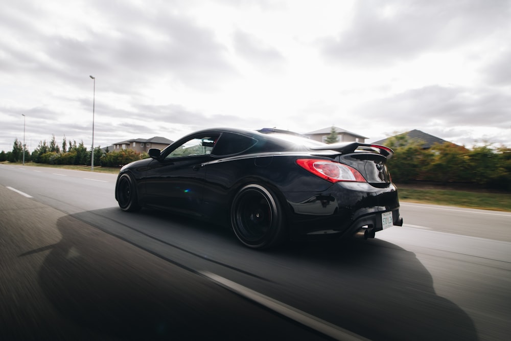 black porsche 911 on road during daytime