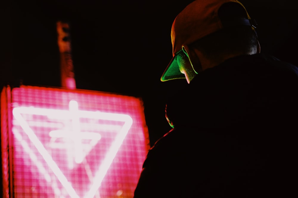 man in black jacket wearing green helmet