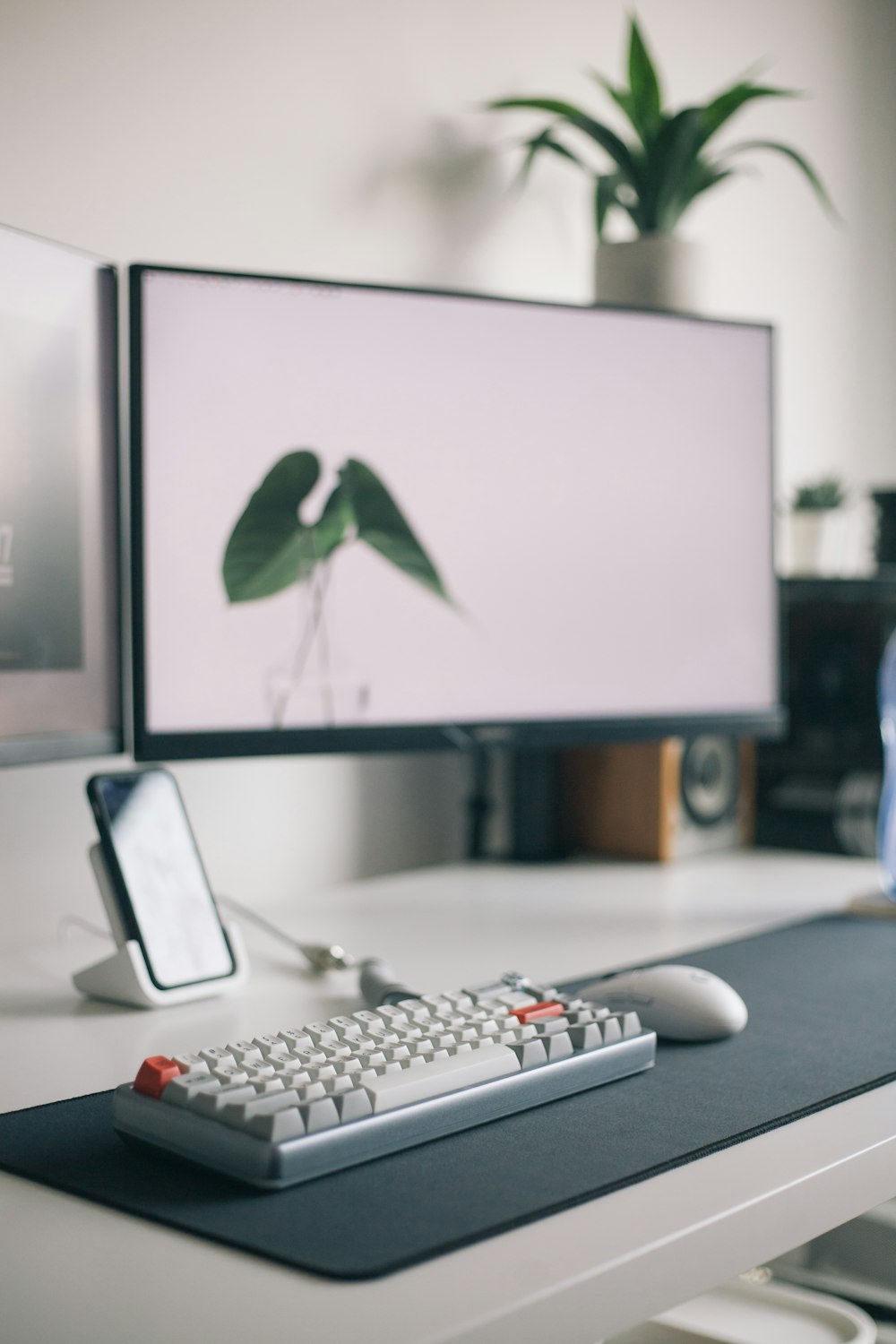 black flat screen computer monitor and white keyboard