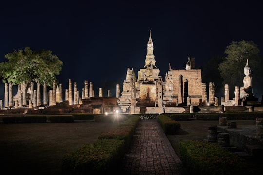 brown concrete building during night time in Sukhothai Historical Park Thailand