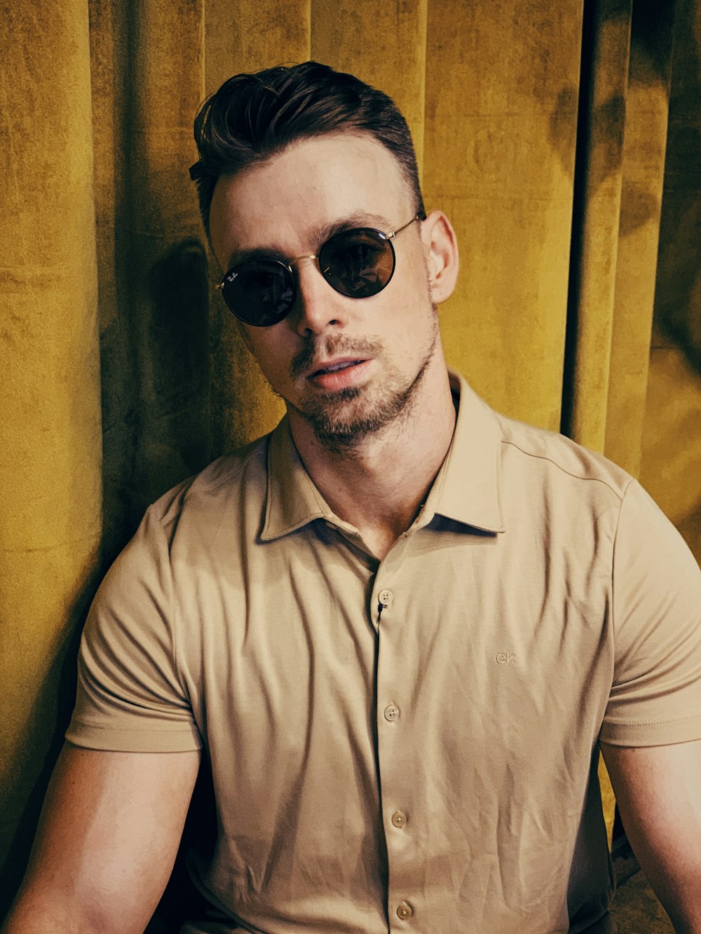 man in black sunglasses and gray button up shirt