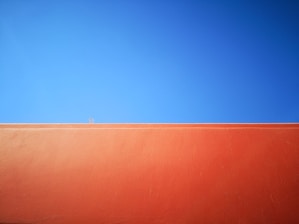 brown concrete wall under blue sky during daytime