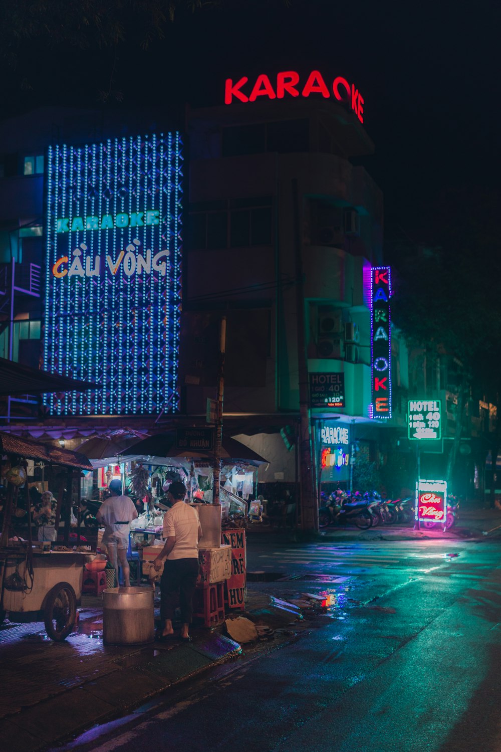 people walking on street during night time