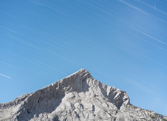 gray rocky mountain under blue sky during daytime in Alpspitz Germany