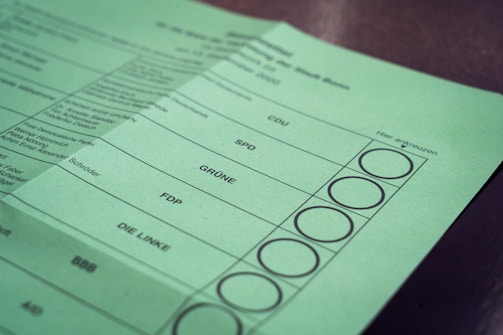 Close-up of a survey form with checkboxes and political party logos.
