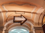 a casino sign hanging from the ceiling of a building