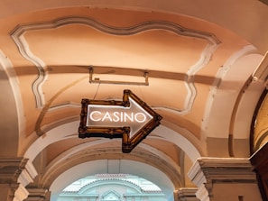 a casino sign hanging from the ceiling of a building