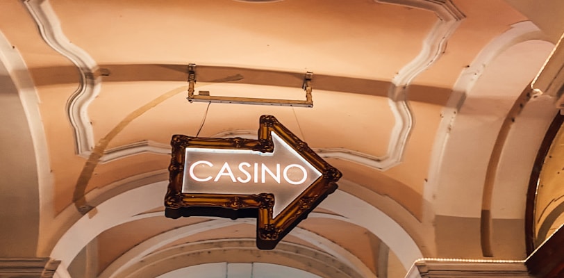 a casino sign hanging from the ceiling of a building