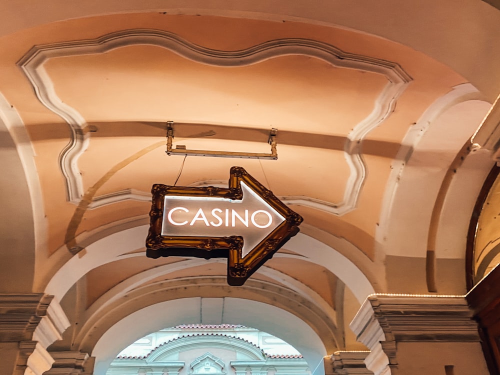 a casino sign hanging from the ceiling of a building