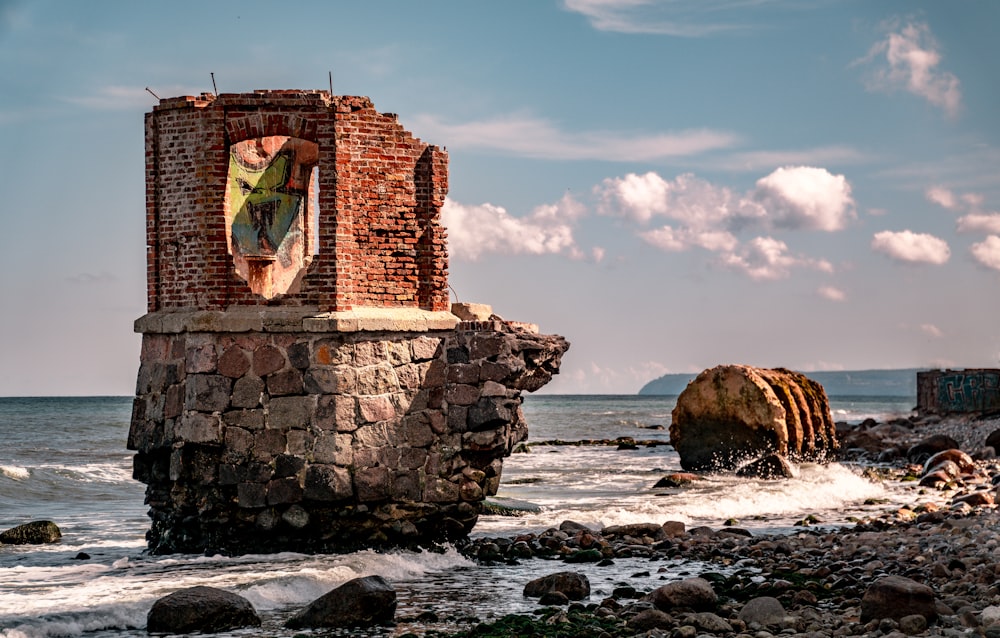 brown brick building on sea shore during daytime