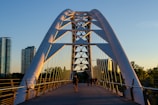 people walking on white bridge during daytime