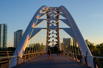 people walking on white bridge during daytime